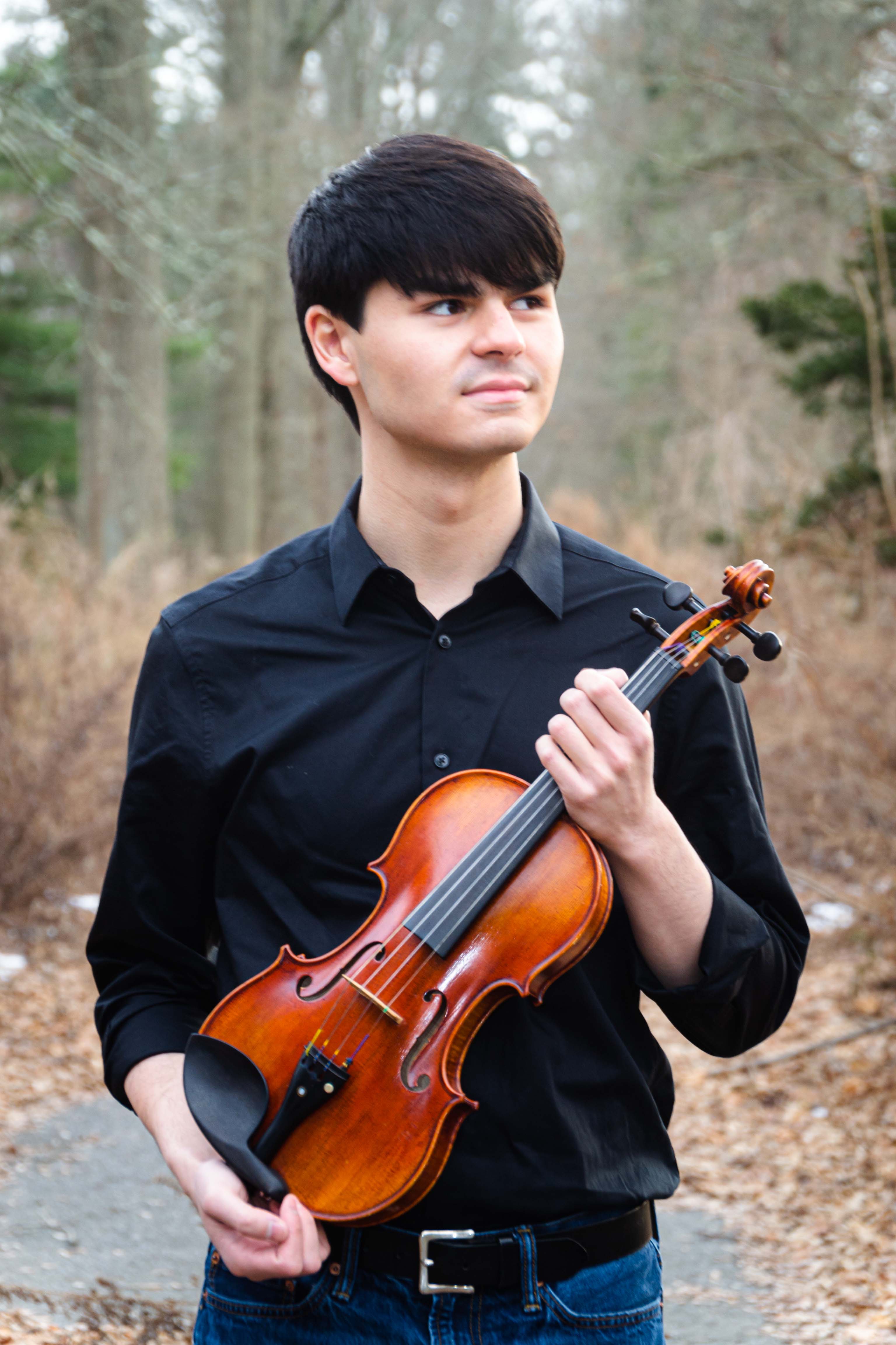Avery Scott with violin in forest setting